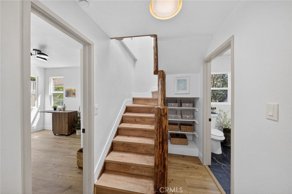 1171 Bear Springs Road Rimforest, CA 92378 - Photo 30 of 43 a view of a hallway with wooden floor and entryway