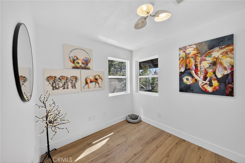 1171 Bear Springs Road Rimforest, CA 92378 - Photo 33 of 43 a view of a room with painting on the wall