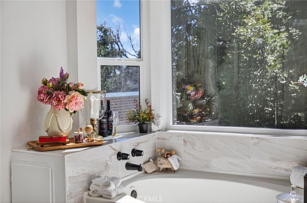 1171 Bear Springs Road Rimforest, CA 92378 - Photo 43 of 43 a view of a bathroom with a tub and a shower