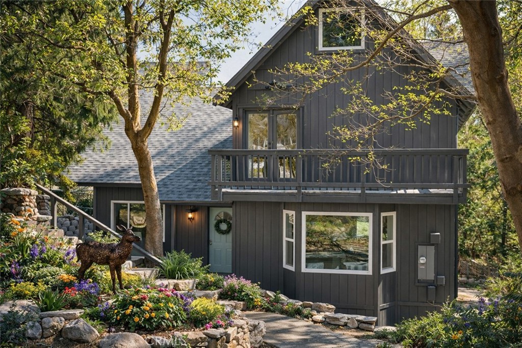 1171 Bear Springs Road Rimforest, CA 92378 - Photo 5 of 43 a front view of a house with a yard