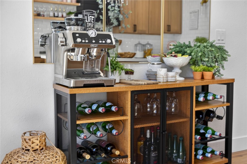 1171 Bear Springs Road Rimforest, CA 92378 - Photo 9 of 43 a kitchen area with lots of clutter and cabinets