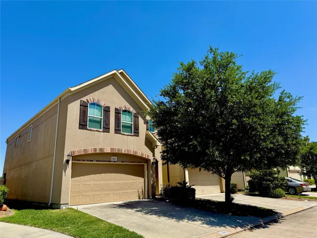 a house view with a garden space