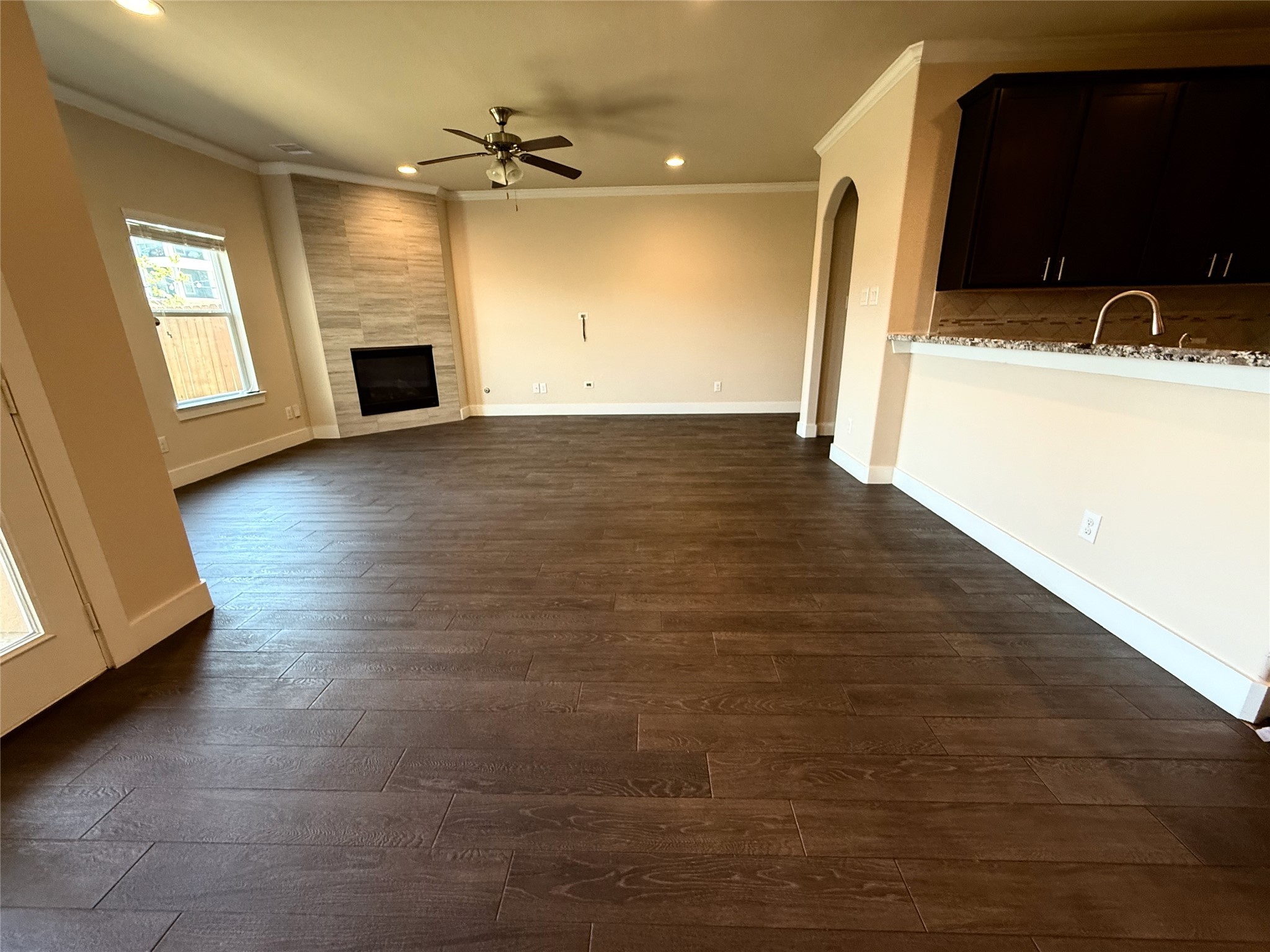 1842 Jara Court Spring, TX 77388 - Photo 19 of 31 a view of empty room with a fireplace and wooden floor