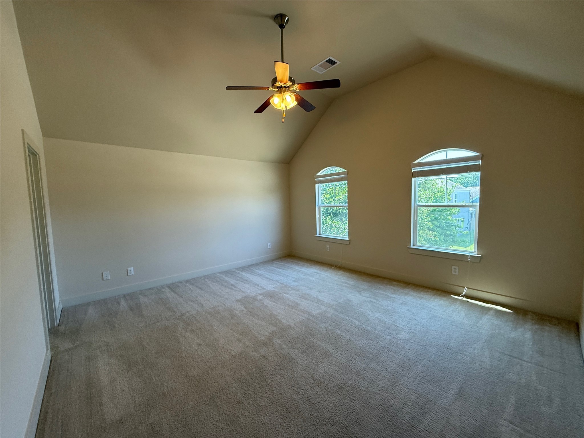 1842 Jara Court Spring, TX 77388 - Photo 22 of 31 an empty room with windows and chandelier fan