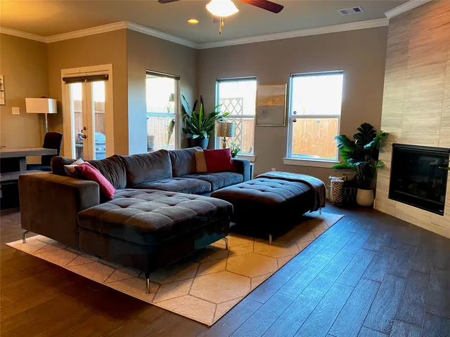 a living room with furniture and a fireplace