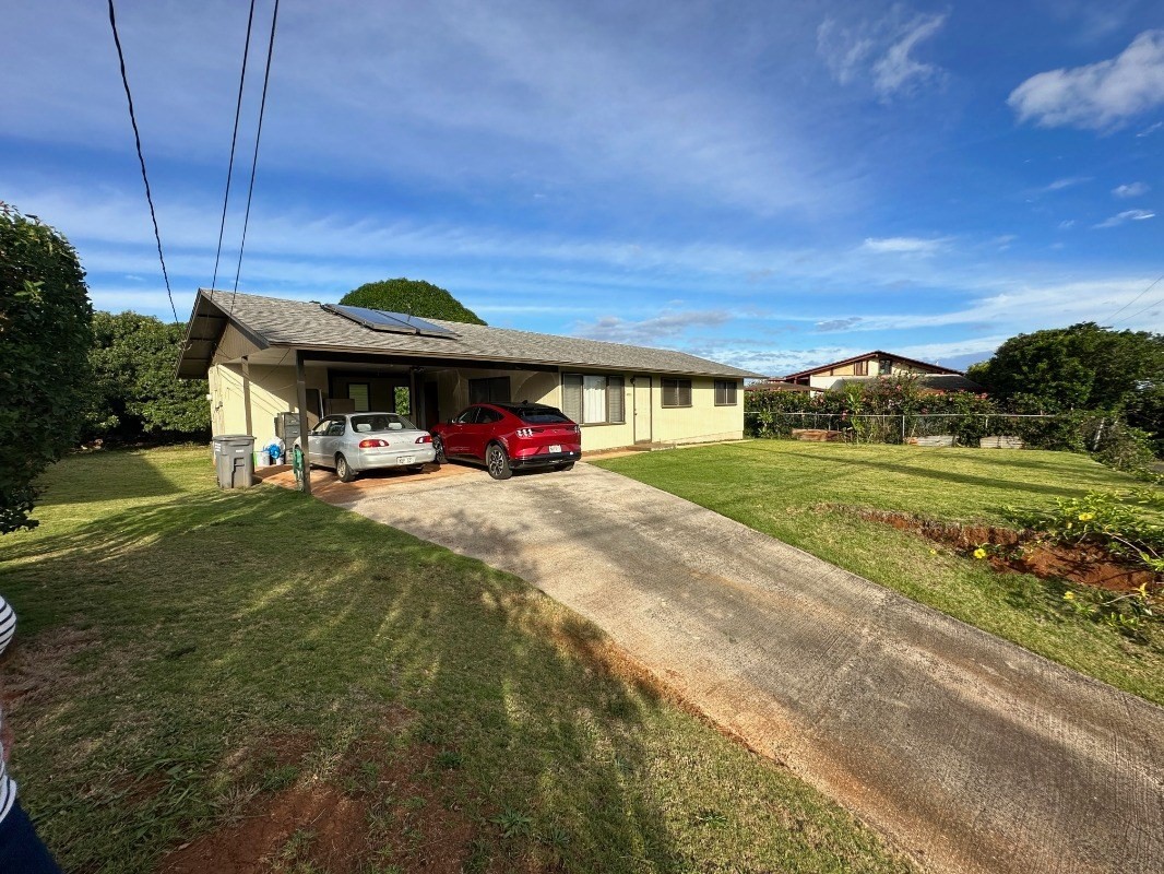 4850 Yamanoha Road Kapaa, HI 96746 - Photo 2 of 22 a car parked in front of a house