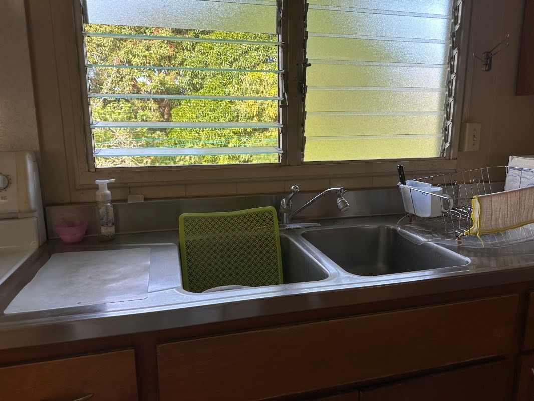 4850 Yamanoha Road Kapaa, HI 96746 - Photo 9 of 22 a kitchen with a sink and a large window