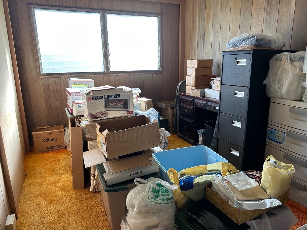 4850 Yamanoha Road Kapaa, HI 96746 - Photo 10 of 22 a bedroom with a bed and wooden floor