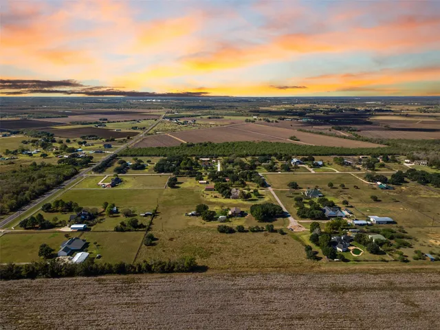 an aerial view of residential building and ocean