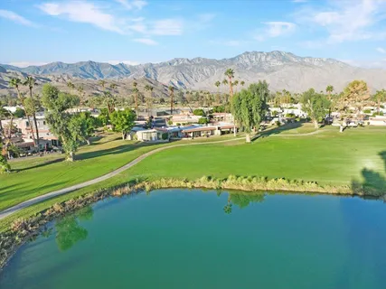 a view of a city with mountains in the background