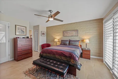 a bedroom with a bed and closet