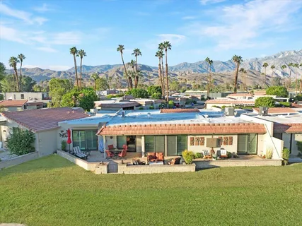 a front view of a building with garden