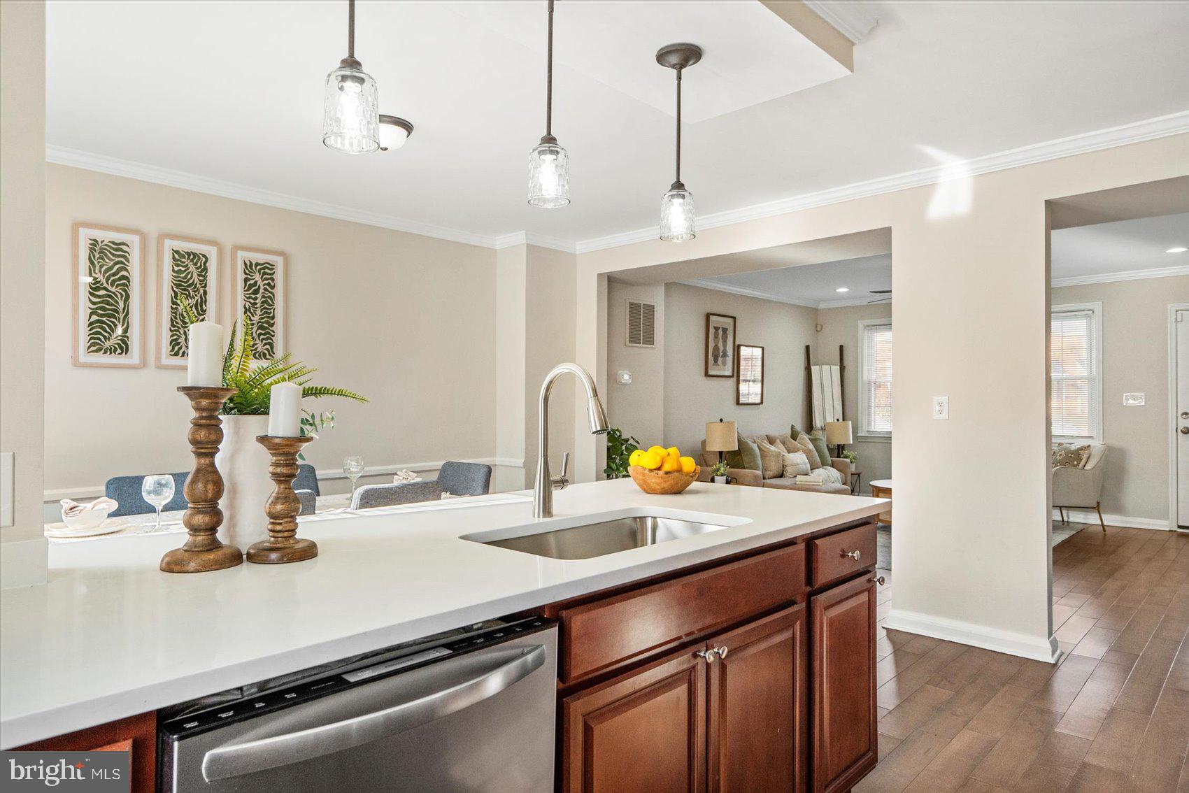 1283 Cedarcroft Road Baltimore, MD 21239 - Photo 15 of 39 a kitchen with a sink a counter space and wooden floor