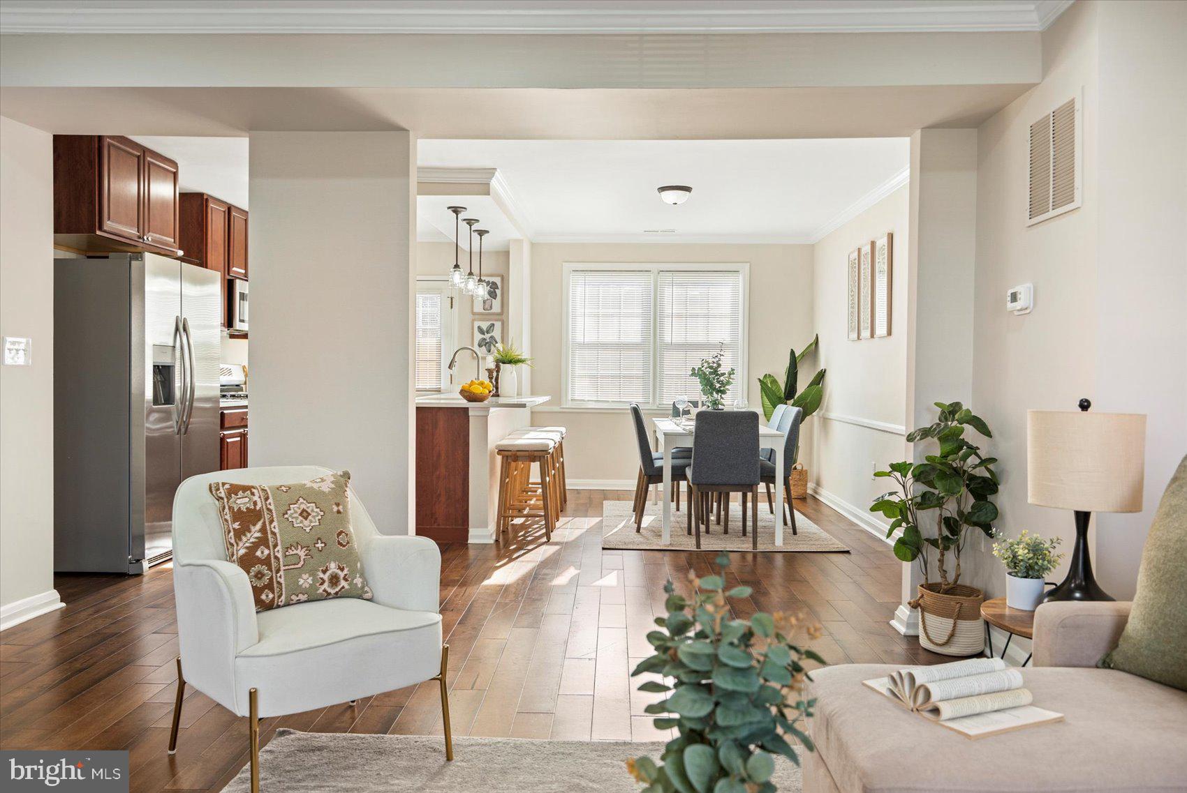 1283 Cedarcroft Road Baltimore, MD 21239 - Photo 17 of 39 a living room with furniture potted plant and a window