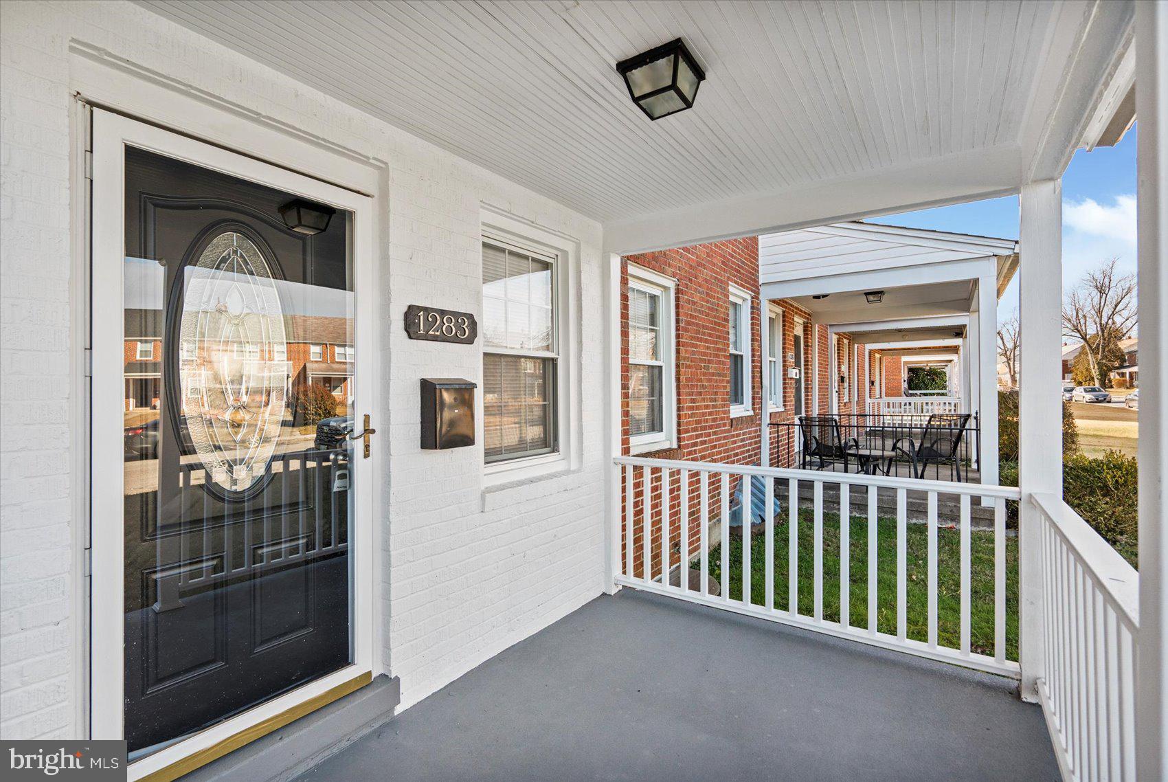 1283 Cedarcroft Road Baltimore, MD 21239 - Photo 2 of 39 a view of a porch with a tv