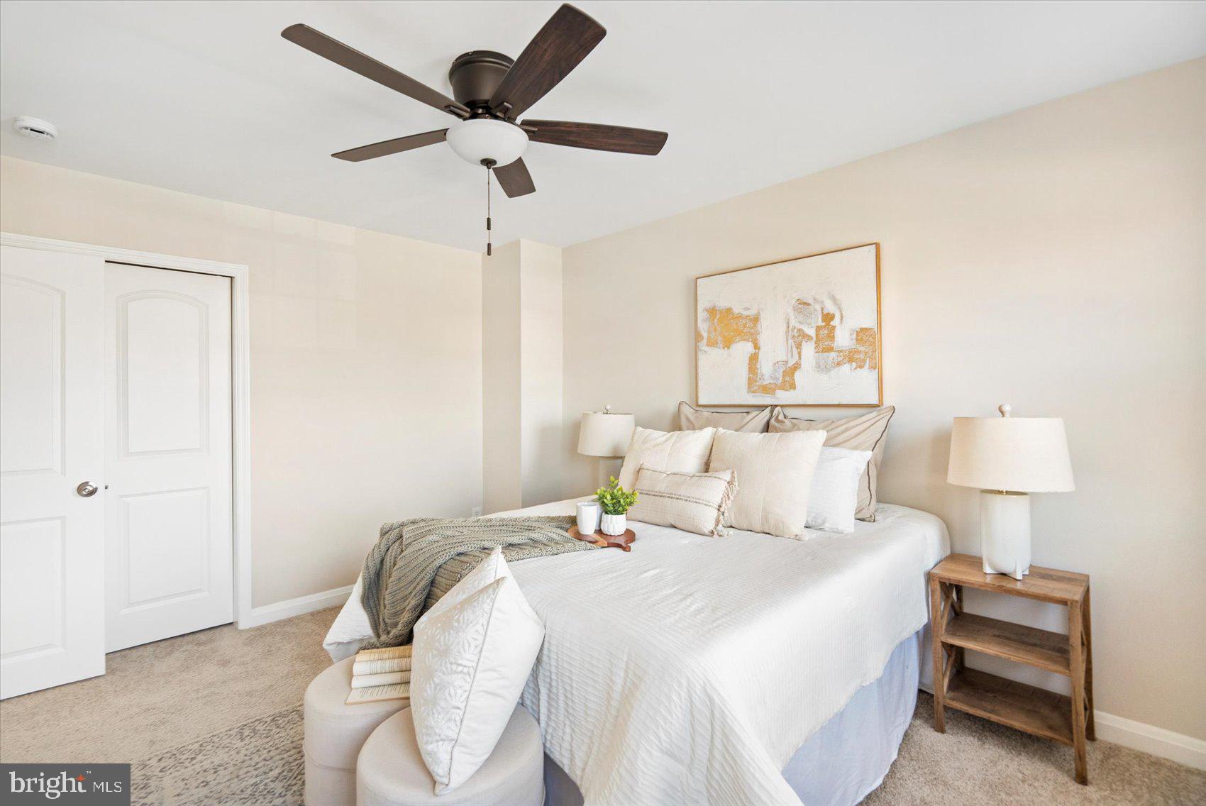 1283 Cedarcroft Road Baltimore, MD 21239 - Photo 21 of 39 a bedroom with a bed and a painting on the wall