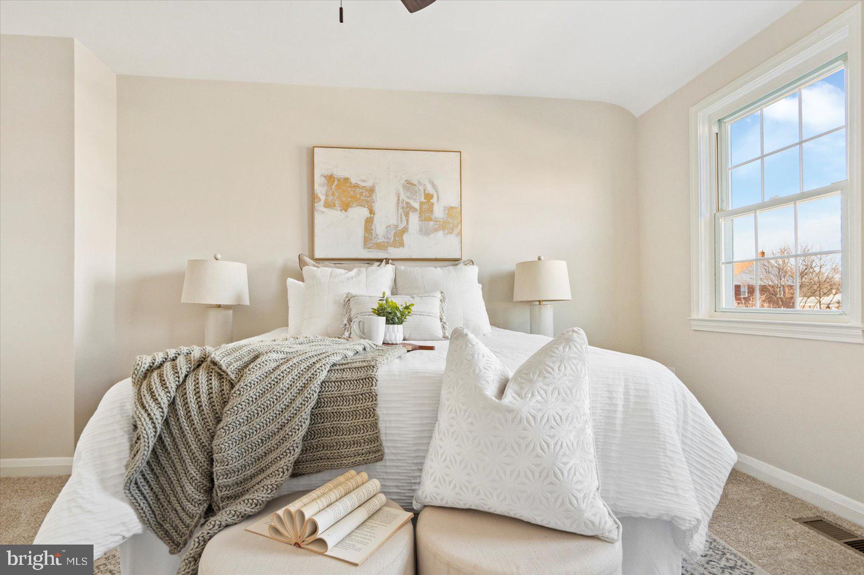 1283 Cedarcroft Road Baltimore, MD 21239 - Photo 22 of 39 a bedroom with a bed and window