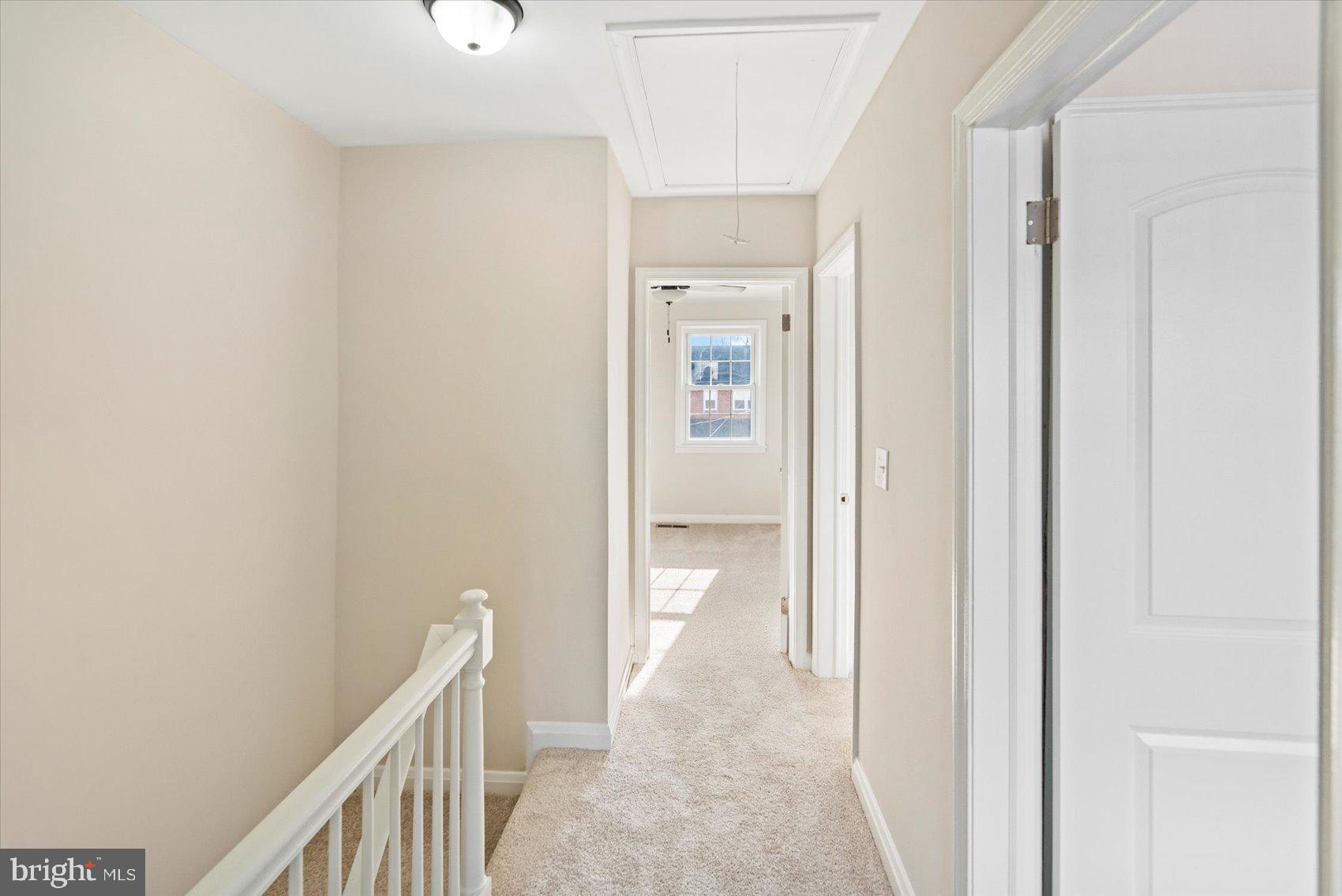1283 Cedarcroft Road Baltimore, MD 21239 - Photo 26 of 39 a view of a hallway with wooden floor
