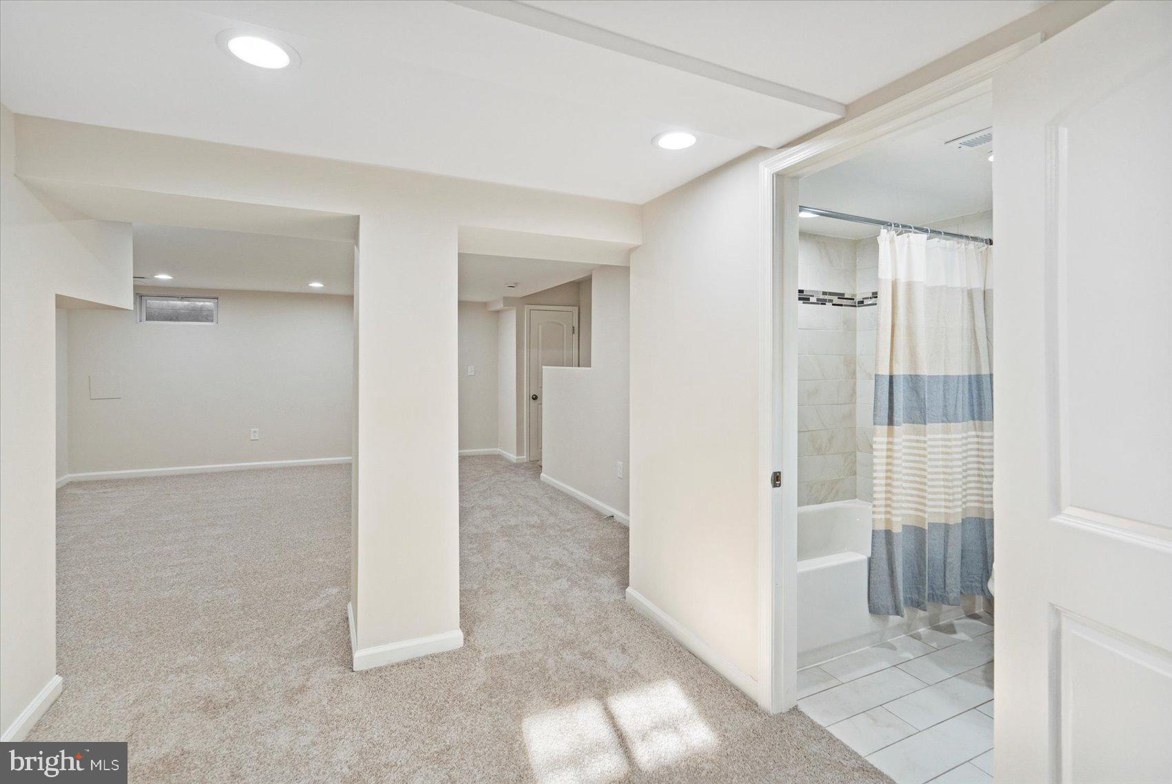 1283 Cedarcroft Road Baltimore, MD 21239 - Photo 33 of 39 a view of a hallway with wooden shelves