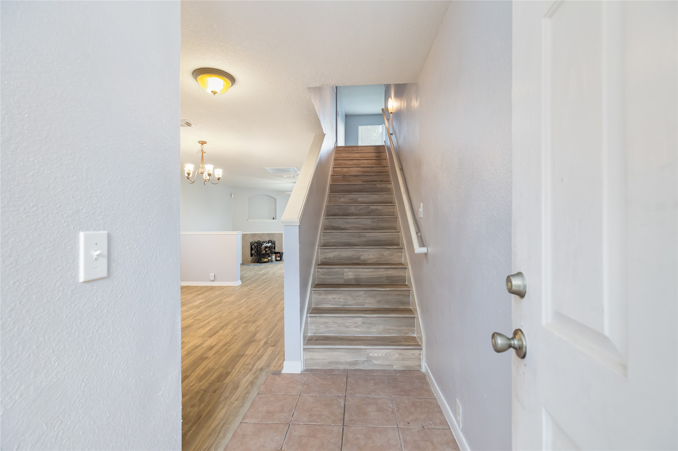 17334 Turquoise Stream Drive Houston, TX 77095 - Photo 9 of 31 a view of a hallway with staircase