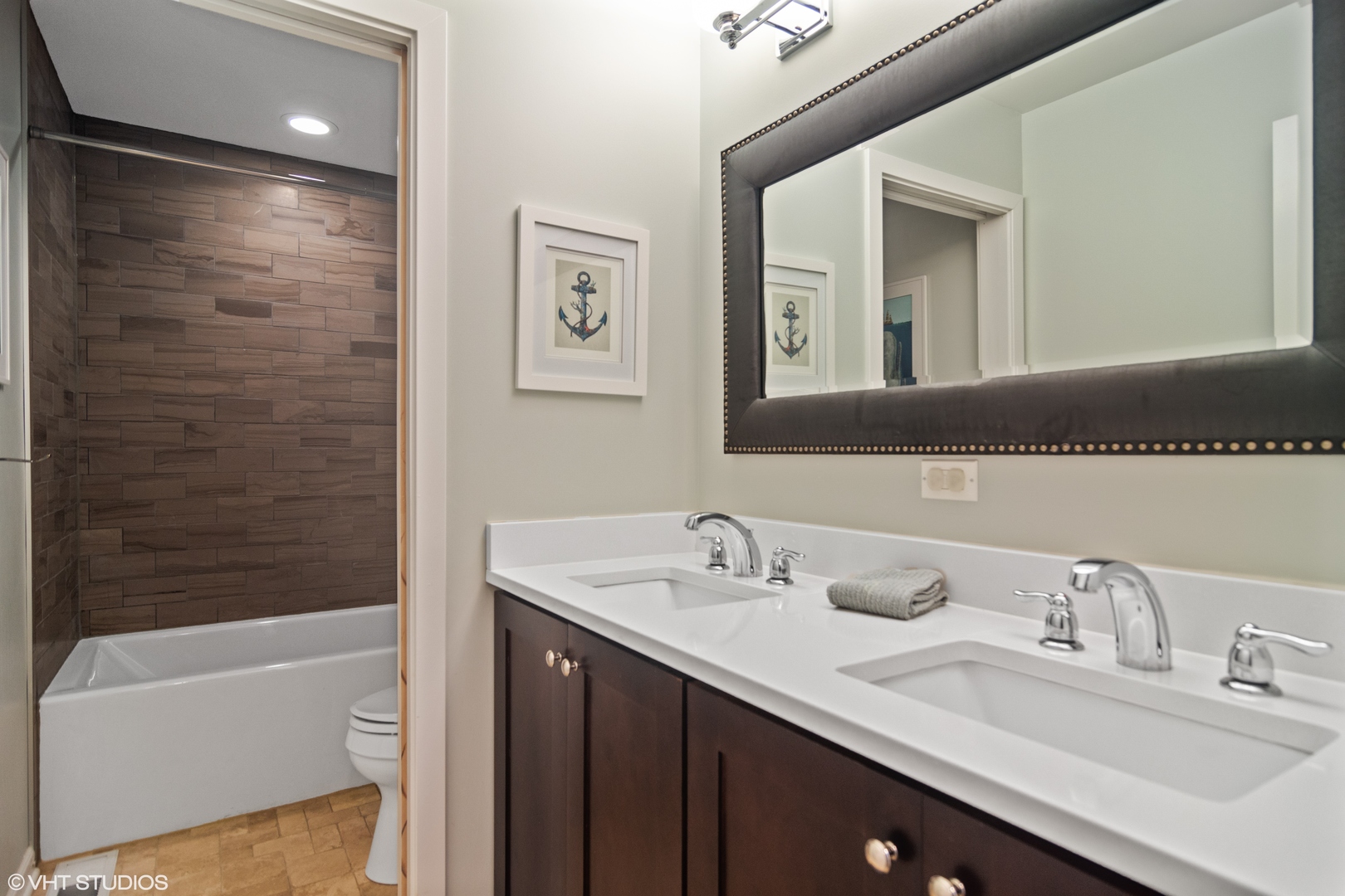 1601 Banbury Road Inverness, IL 60067 - Photo 28 of 36 a bathroom with a tub sink double vanity and mirror