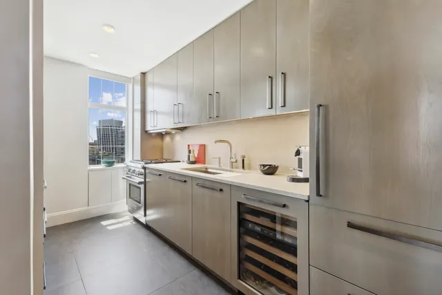 a kitchen with a cabinets and white appliances