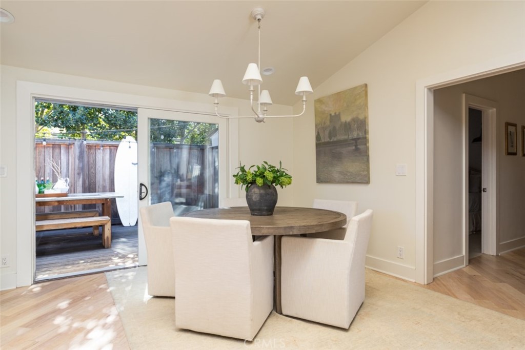 1941 Commodore Road Newport Beach, CA 92660 - Photo 12 of 35 a dining room with furniture and a chandelier