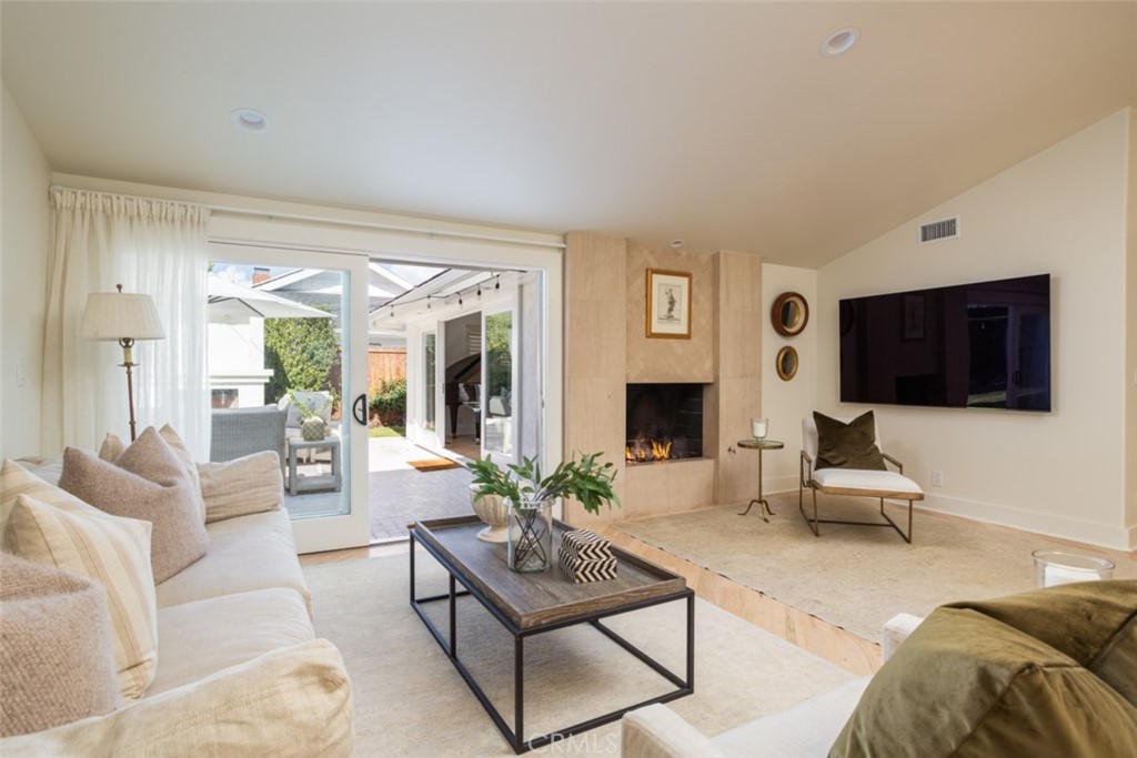 1941 Commodore Road Newport Beach, CA 92660 - Photo 13 of 35 a living room with furniture or couch and a flat screen tv