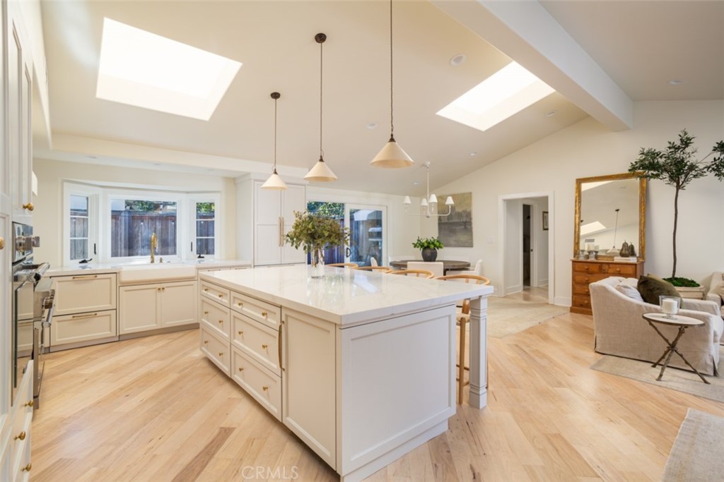 1941 Commodore Road Newport Beach, CA 92660 - Photo 14 of 35 a large white kitchen with a large window