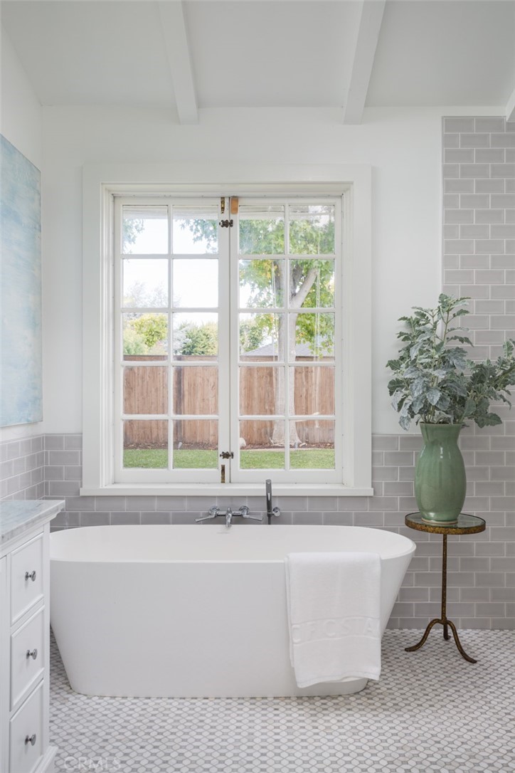 1941 Commodore Road Newport Beach, CA 92660 - Photo 18 of 35 a white bath tub sitting in a bathroom next to a window
