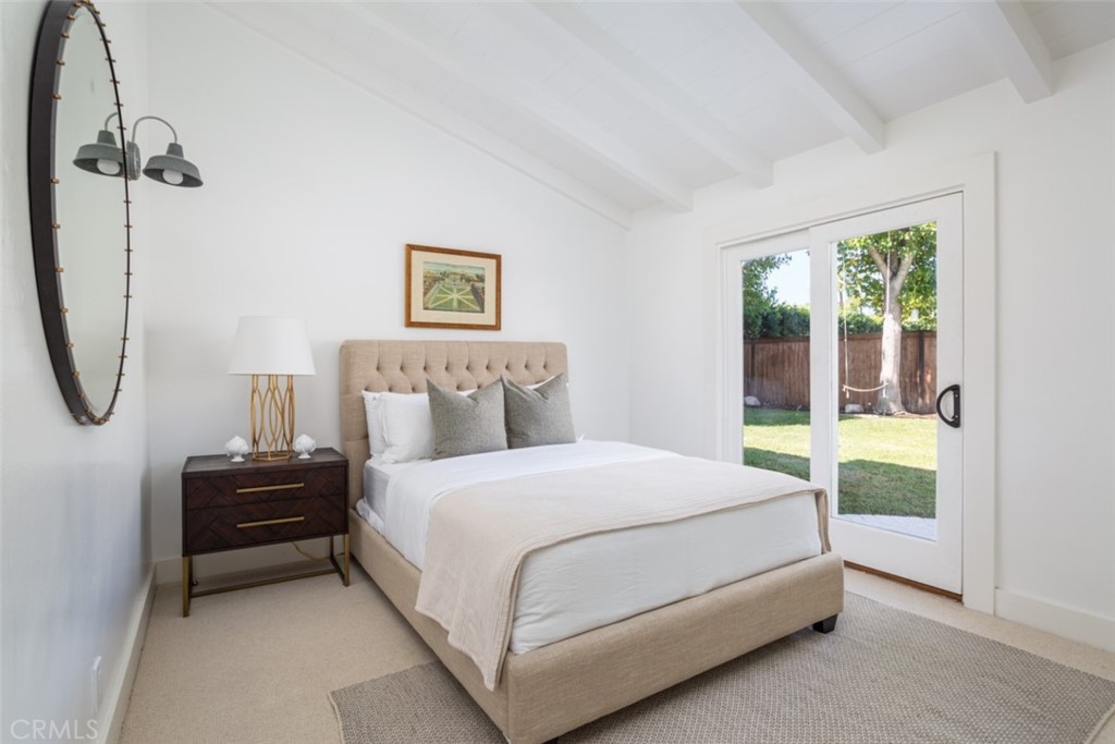1941 Commodore Road Newport Beach, CA 92660 - Photo 20 of 35 a bedroom with a bed a mirror and a window