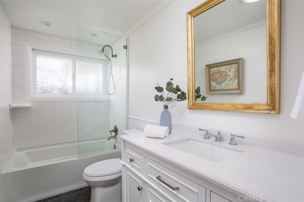 1941 Commodore Road Newport Beach, CA 92660 - Photo 24 of 35 a bathroom with a granite countertop sink toilet and shower