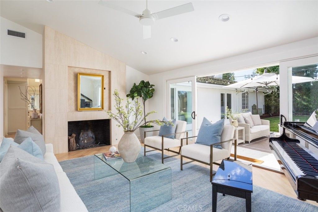 1941 Commodore Road Newport Beach, CA 92660 - Photo 5 of 35 a living room with furniture a fireplace and a table
