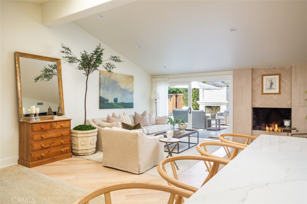 1941 Commodore Road Newport Beach, CA 92660 - Photo 9 of 35 a living room with furniture a large window and a fireplace