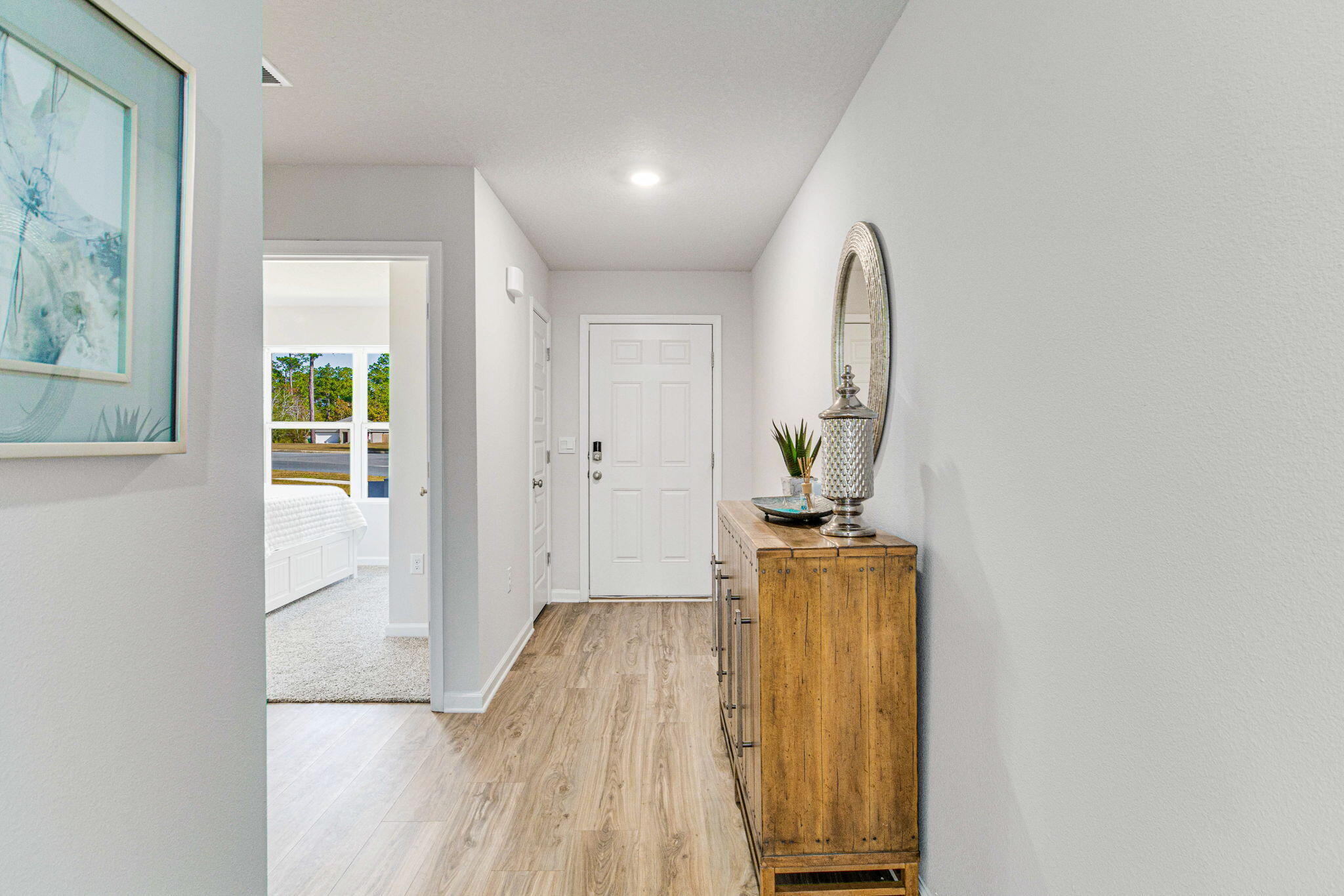 3060 Jane Lane Crestview, FL 32539 - Photo 2 of 30 a view of a hallway with wooden floor