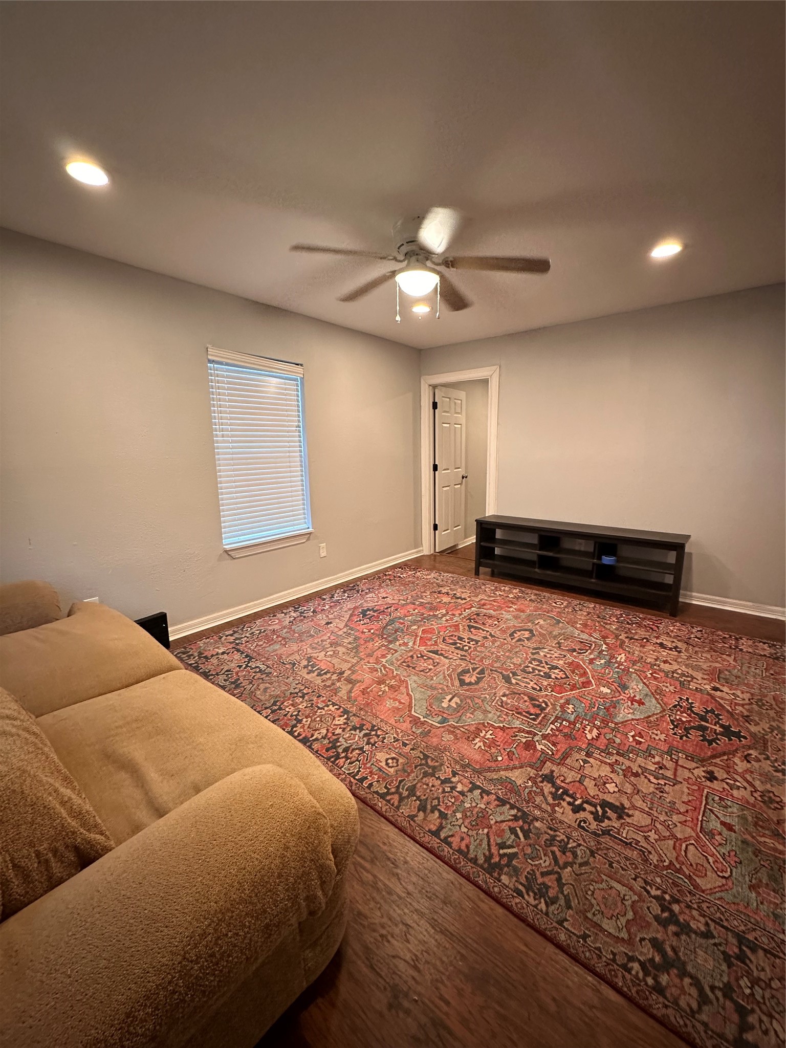 4802 Eppes Street Houston, TX 77021 - Photo 31 of 34 a bedroom with a bed and a ceiling fan