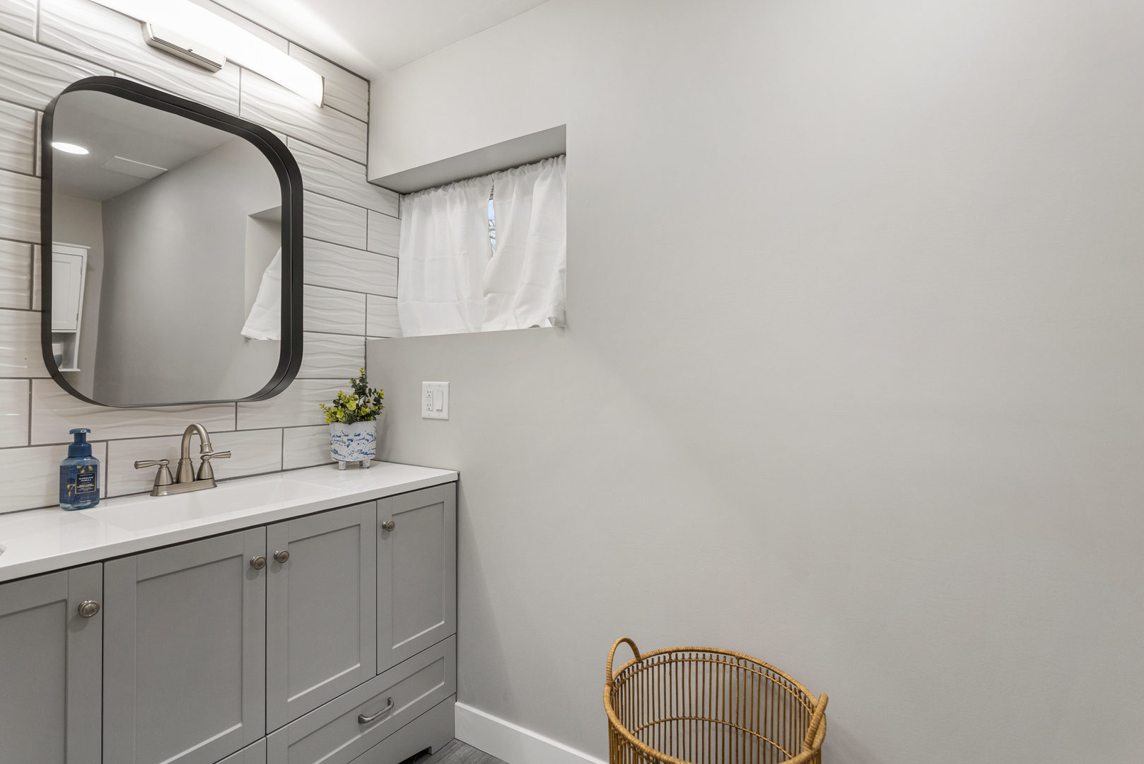 706 Madison Street Monticello, IL 61856 - Photo 15 of 38 a bathroom with a granite countertop sink and a mirror
