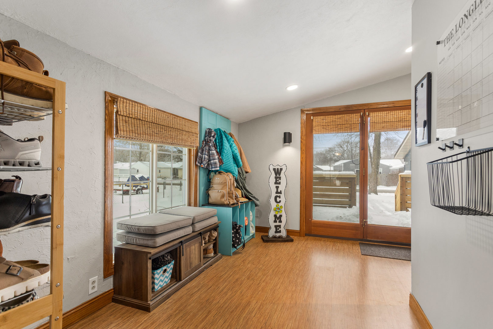 706 Madison Street Monticello, IL 61856 - Photo 19 of 38 a view of an empty room with furniture wooden floor and a window