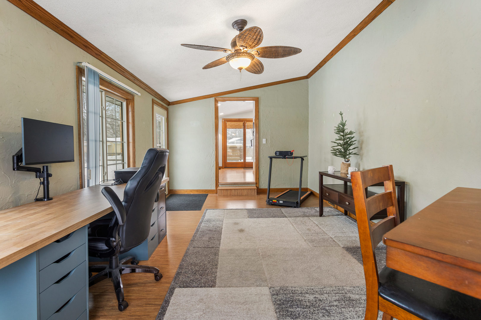 706 Madison Street Monticello, IL 61856 - Photo 21 of 38 a view of a workspace with furniture and a window
