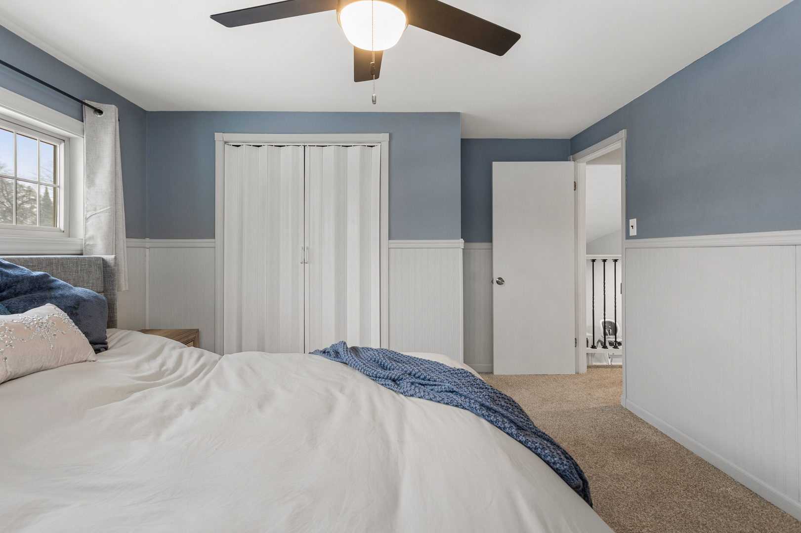 706 Madison Street Monticello, IL 61856 - Photo 24 of 38 a bedroom with a bed and a window