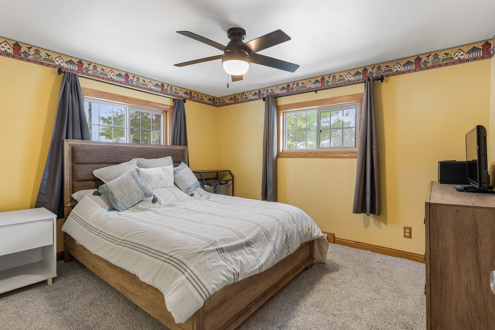 706 Madison Street Monticello, IL 61856 - Photo 25 of 38 a bedroom with a large bed and a window