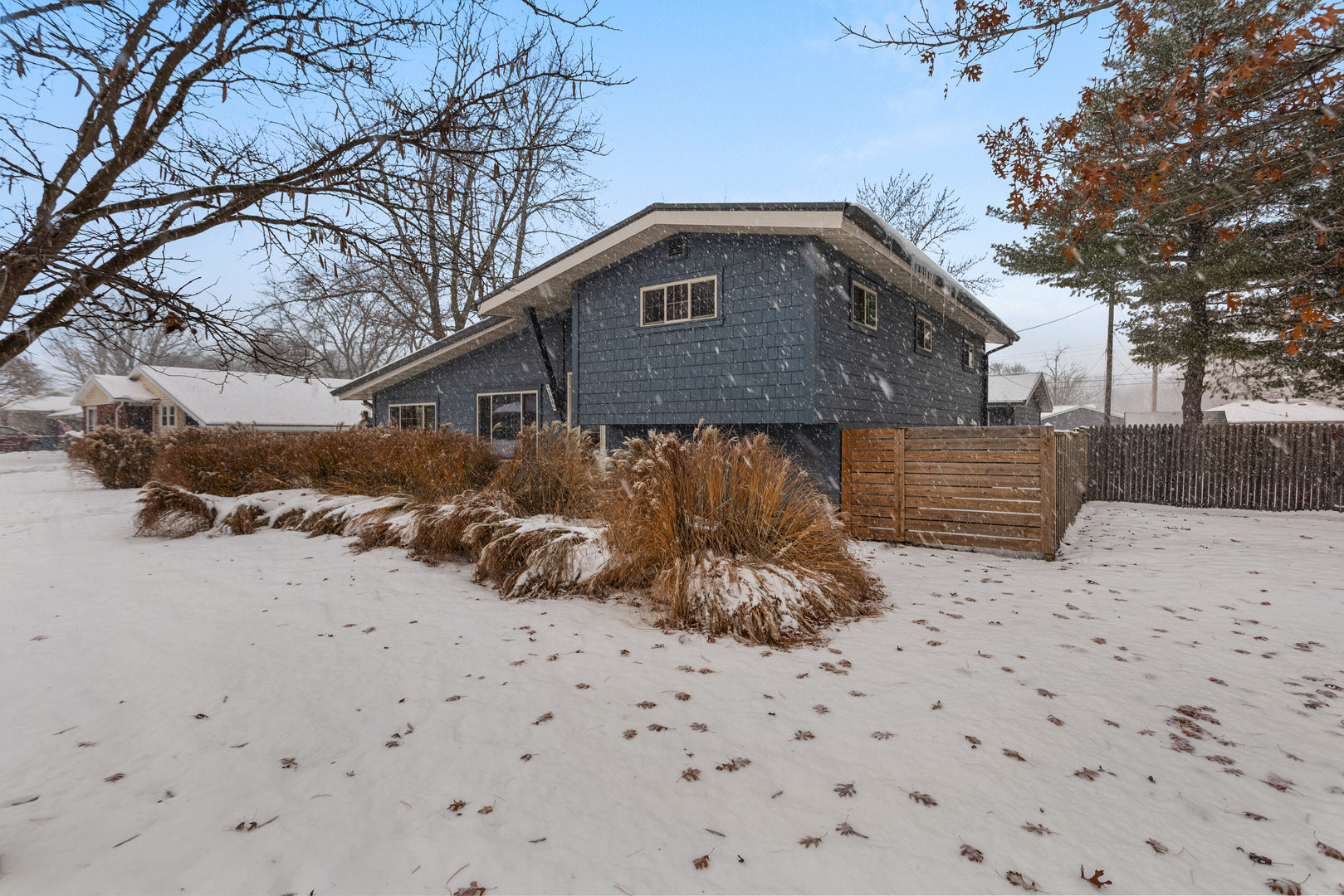 706 Madison Street Monticello, IL 61856 - Photo 37 of 38 a front view of a house with a yard covered in snow