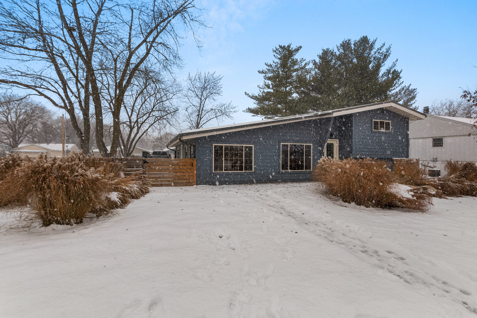 706 Madison Street Monticello, IL 61856 - Photo 38 of 38 a view of a house with a yard covered in snow