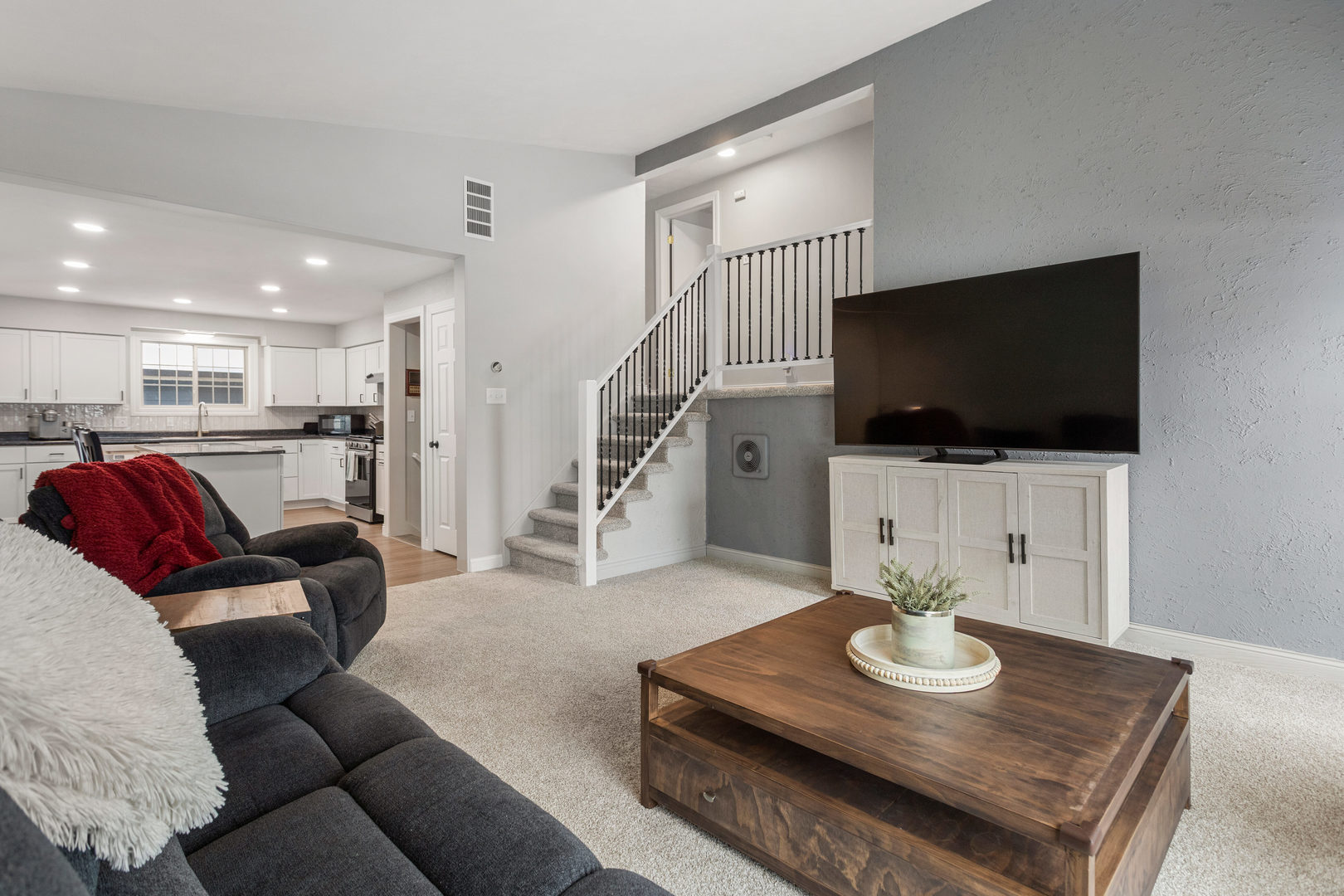 706 Madison Street Monticello, IL 61856 - Photo 5 of 38 a living room with furniture and a flat screen tv