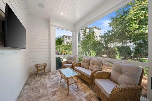 a view of a chairs and table in a patio