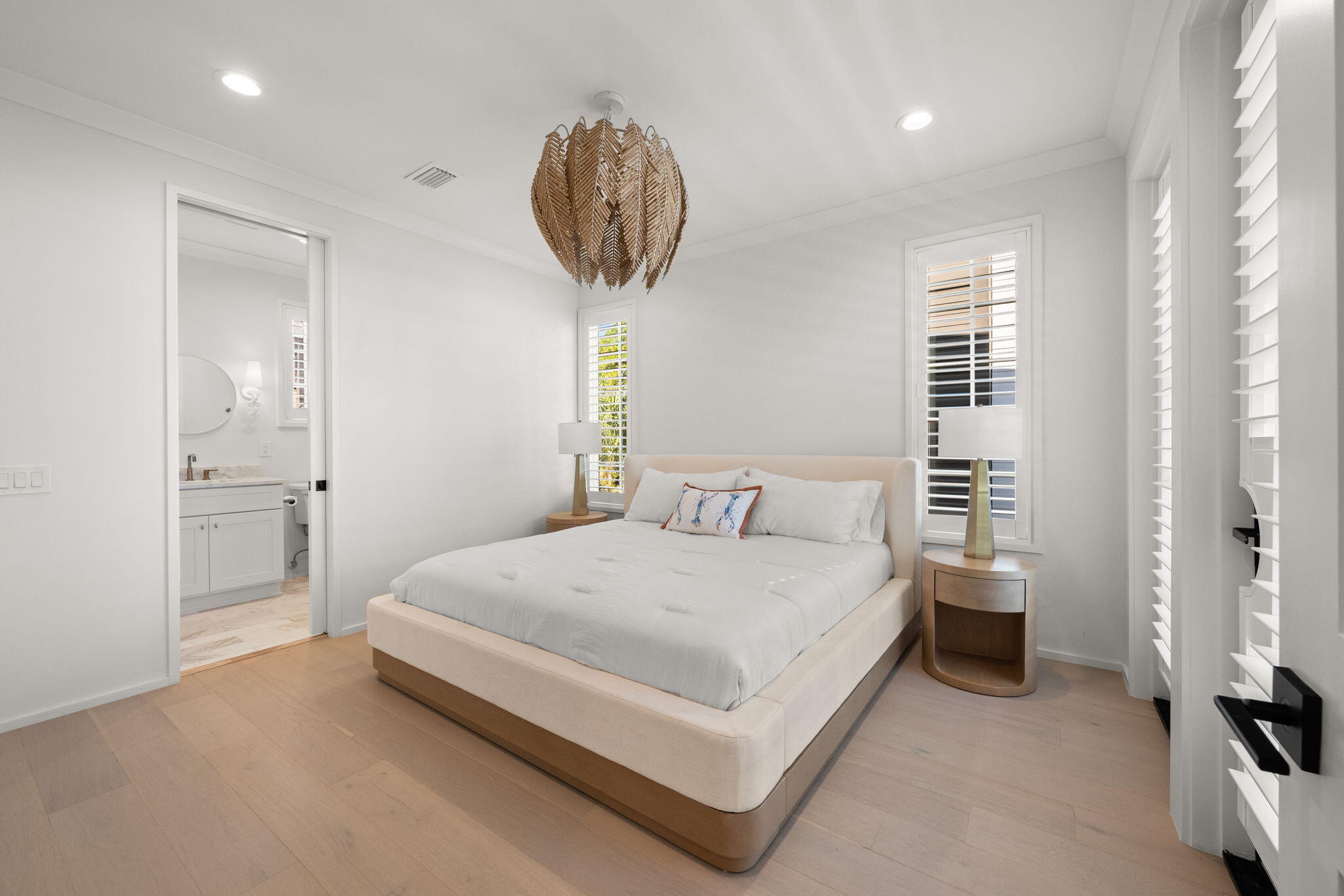 35 Seapointe Lane Santa Rosa Beach, FL 32459 - Photo 16 of 72 a bedroom with a bed and a chandelier