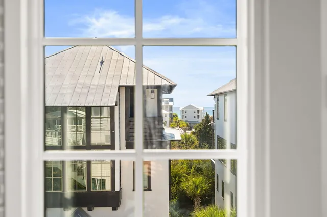 an aerial view of multiple houses with yard
