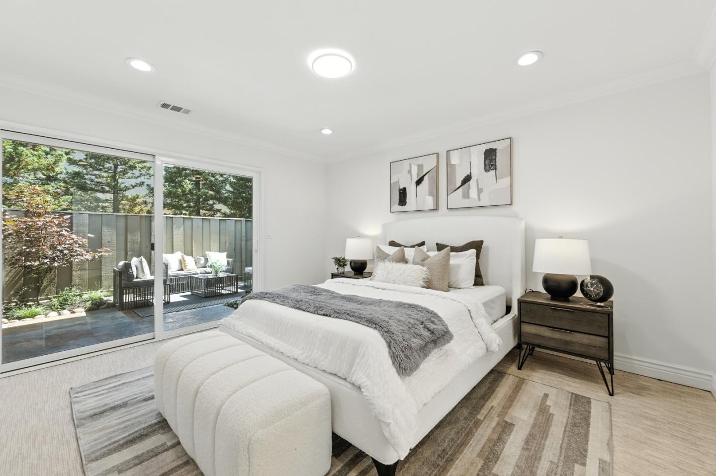 1 Los Altos Square Los Altos, CA 94022 - Photo 11 of 29 a bedroom with a large bed and a large window