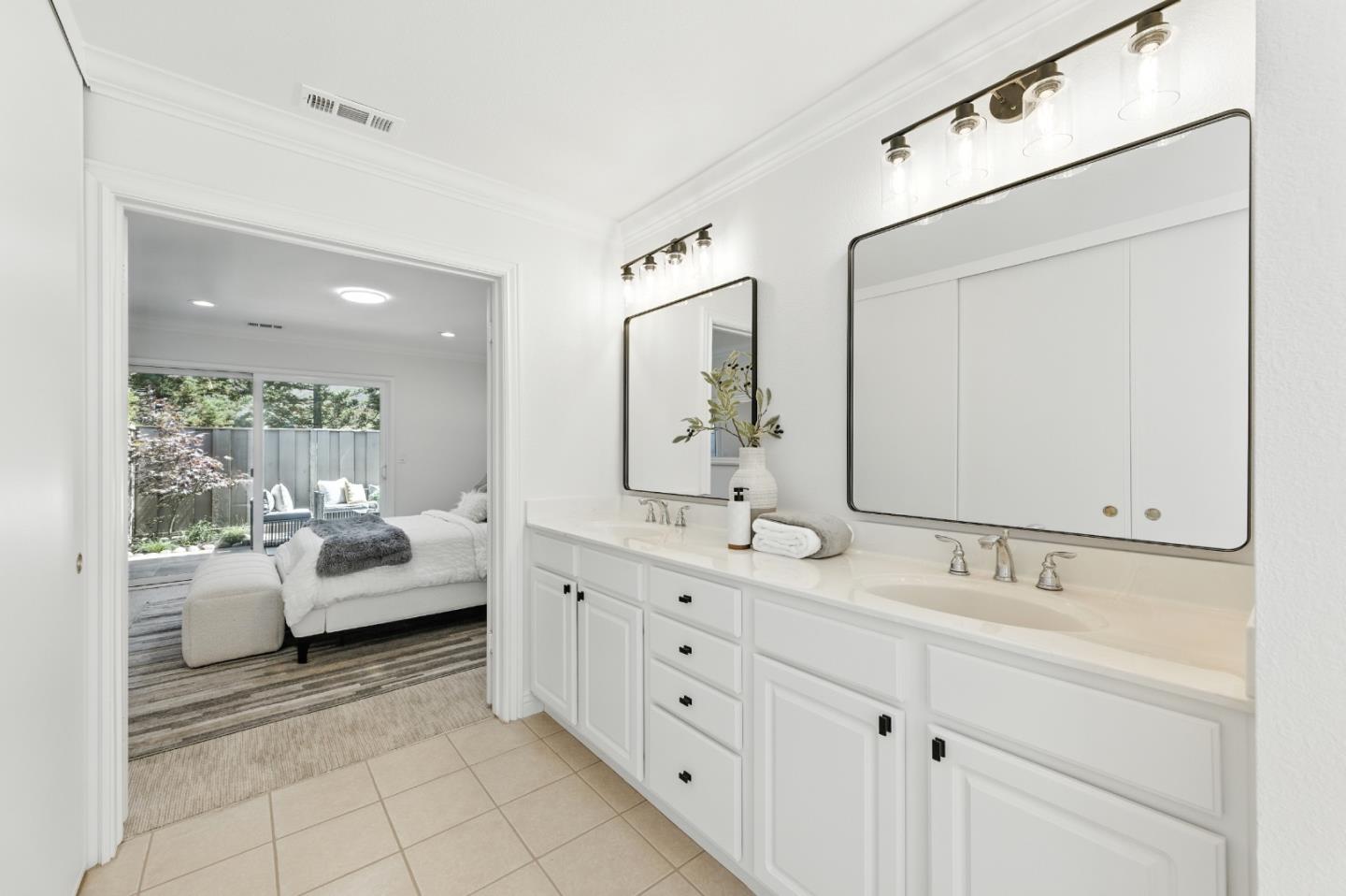 1 Los Altos Square Los Altos, CA 94022 - Photo 12 of 29 a en suite bathroom with a double vanity sink and mirrors