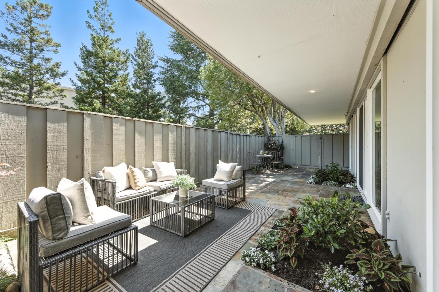 1 Los Altos Square Los Altos, CA 94022 - Photo 17 of 29 a backyard of a house with table and chairs